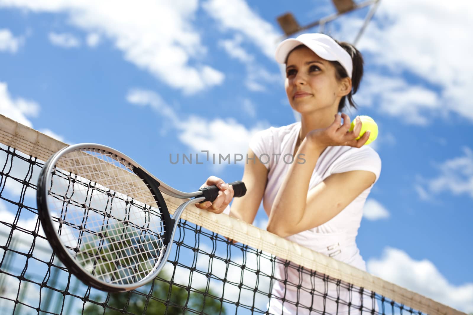 Young woman playing tennis, natural colorful tone