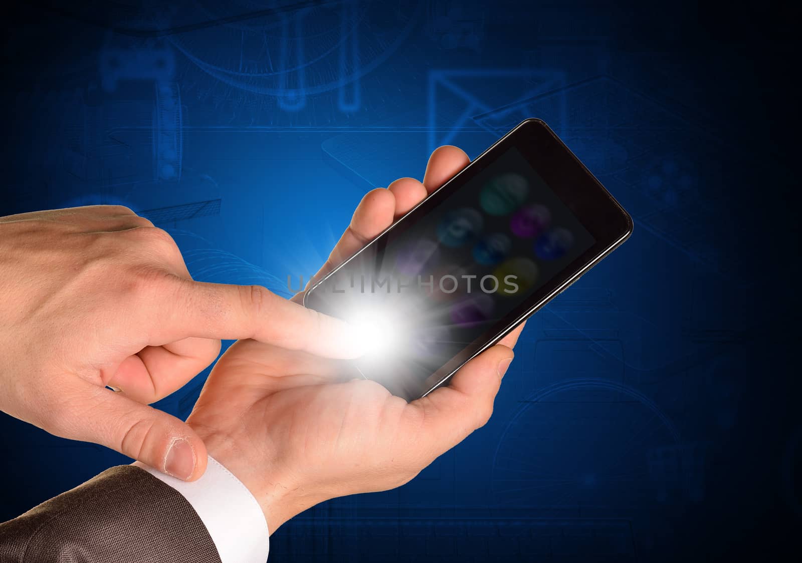 Businessmans hand holding mobile on abstract blue background
