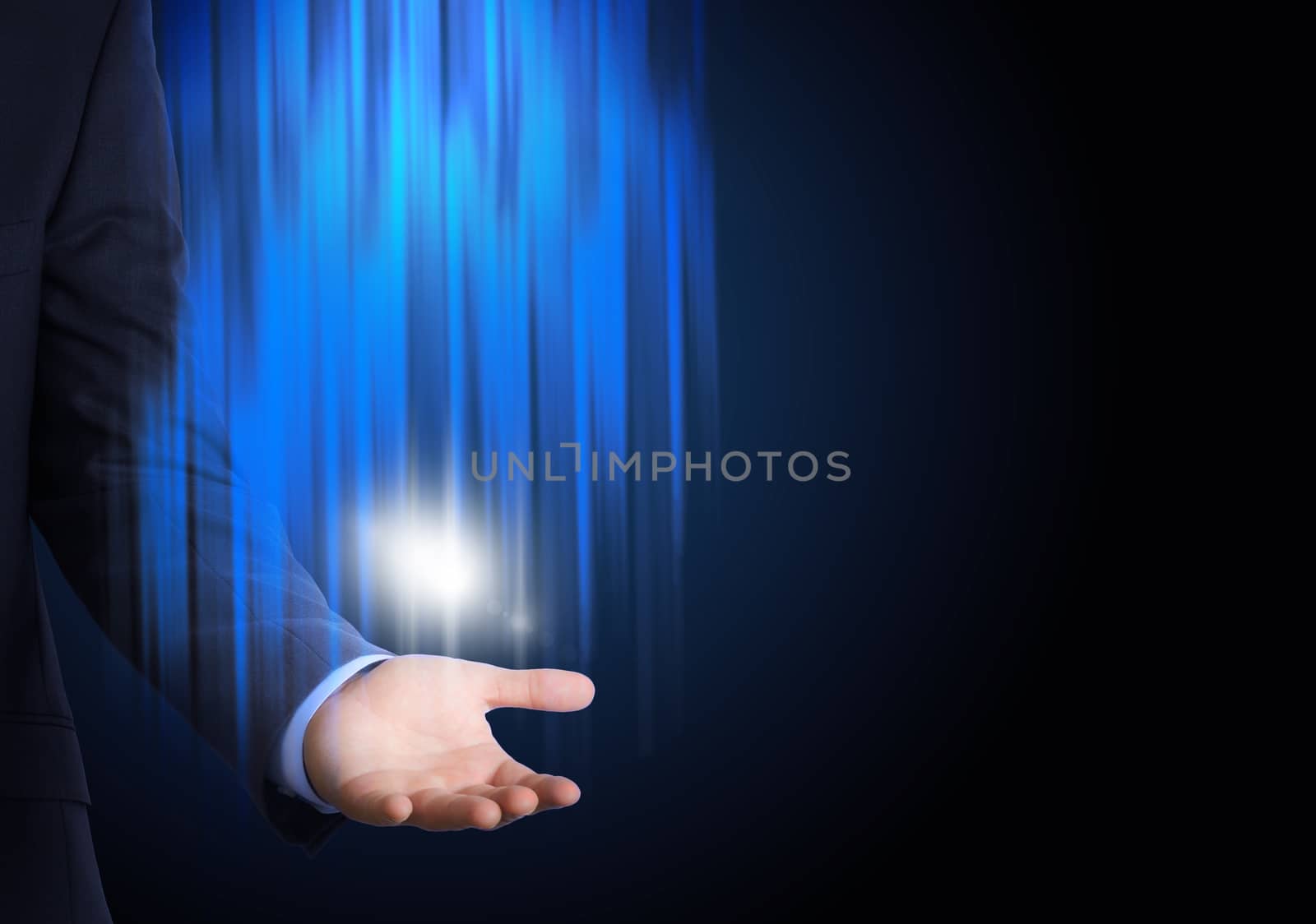 Businessman with spotlight on abstract blue background
