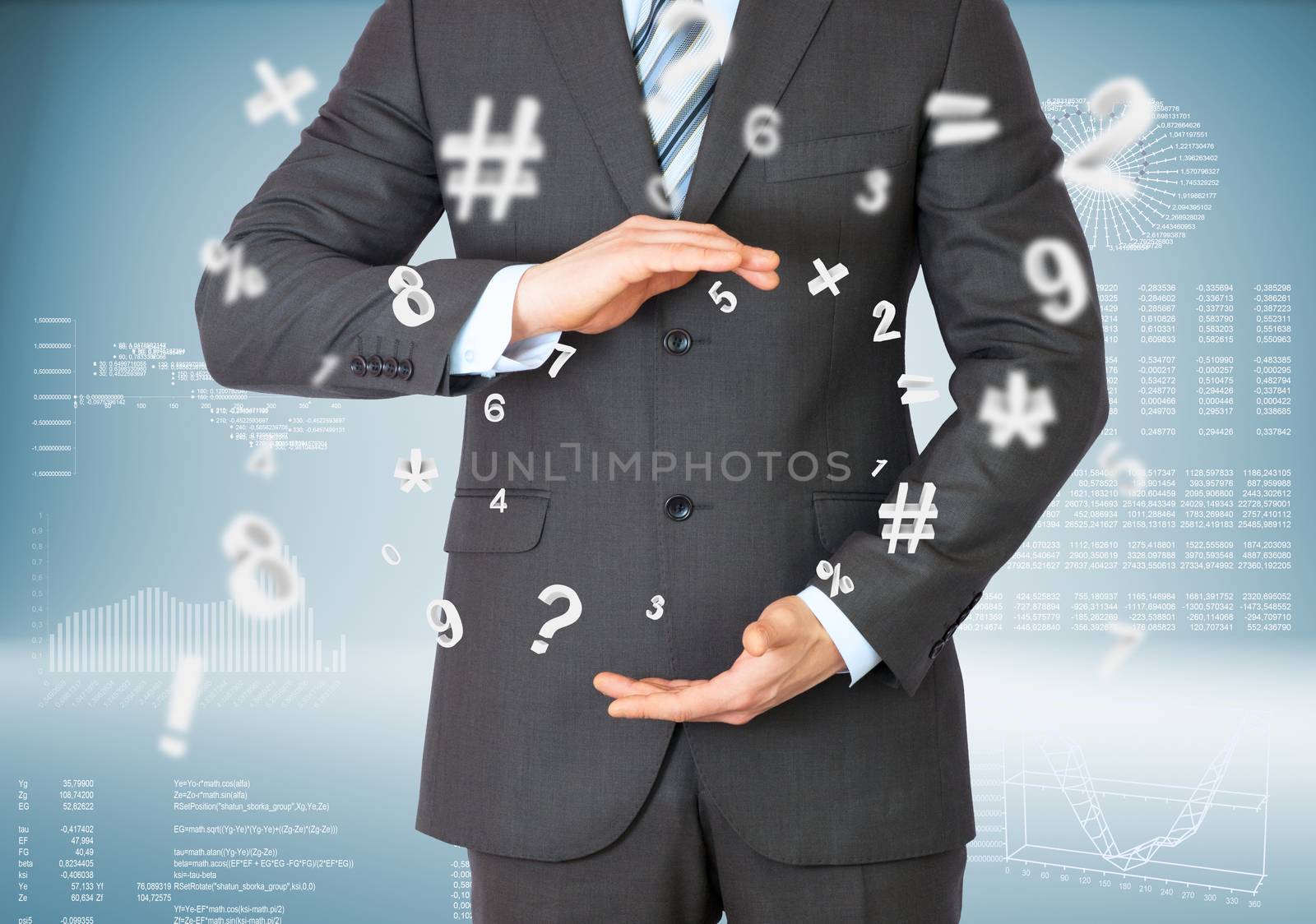 Businessman in suit on abstract blue background with graphical charts