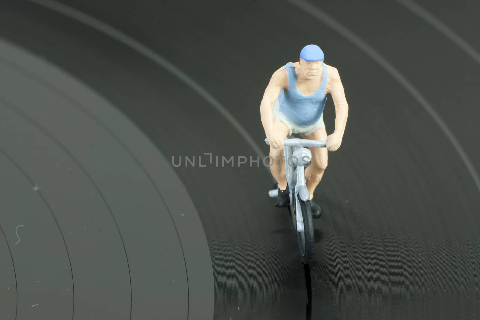 Two model people in cycle race by christopherhall