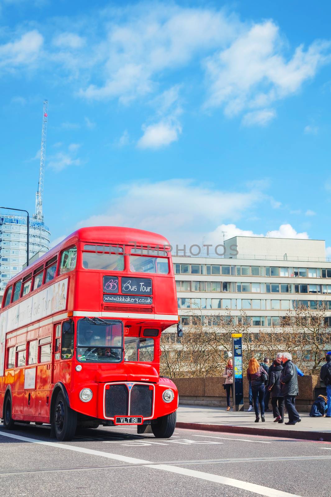 LONDON - APRIL 5: Iconic red double decker bus on April 5, 2015 in London, UK. The London Bus is one of London's principal icons, the archetypal red rear-entrance Routemaster recognised worldwide.