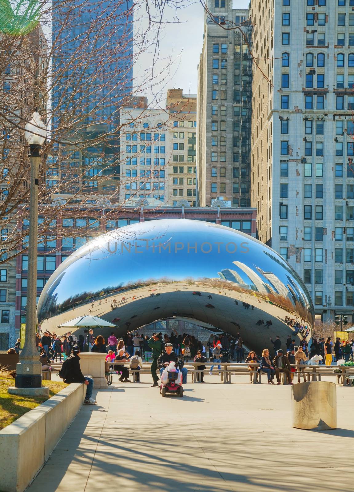 CHICAGO - APRIL 9: Cloud Gate sculpture in Millenium park on April 9, 2014 in Chicago, IL. This public sculpture is the centerpiece of the AT&T Plaza in Millennium Park within the Loop area.