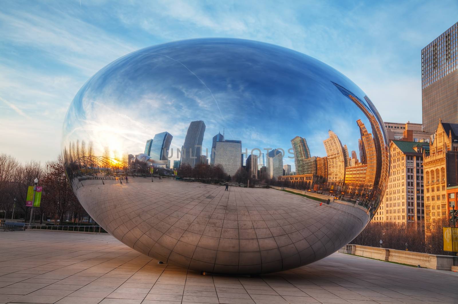 CHICAGO - APRIL 10: Cloud Gate sculpture in Millenium park on April 10, 2014 in Chicago, IL. This public sculpture is the centerpiece of the AT&T Plaza in Millennium Park within the Loop area.