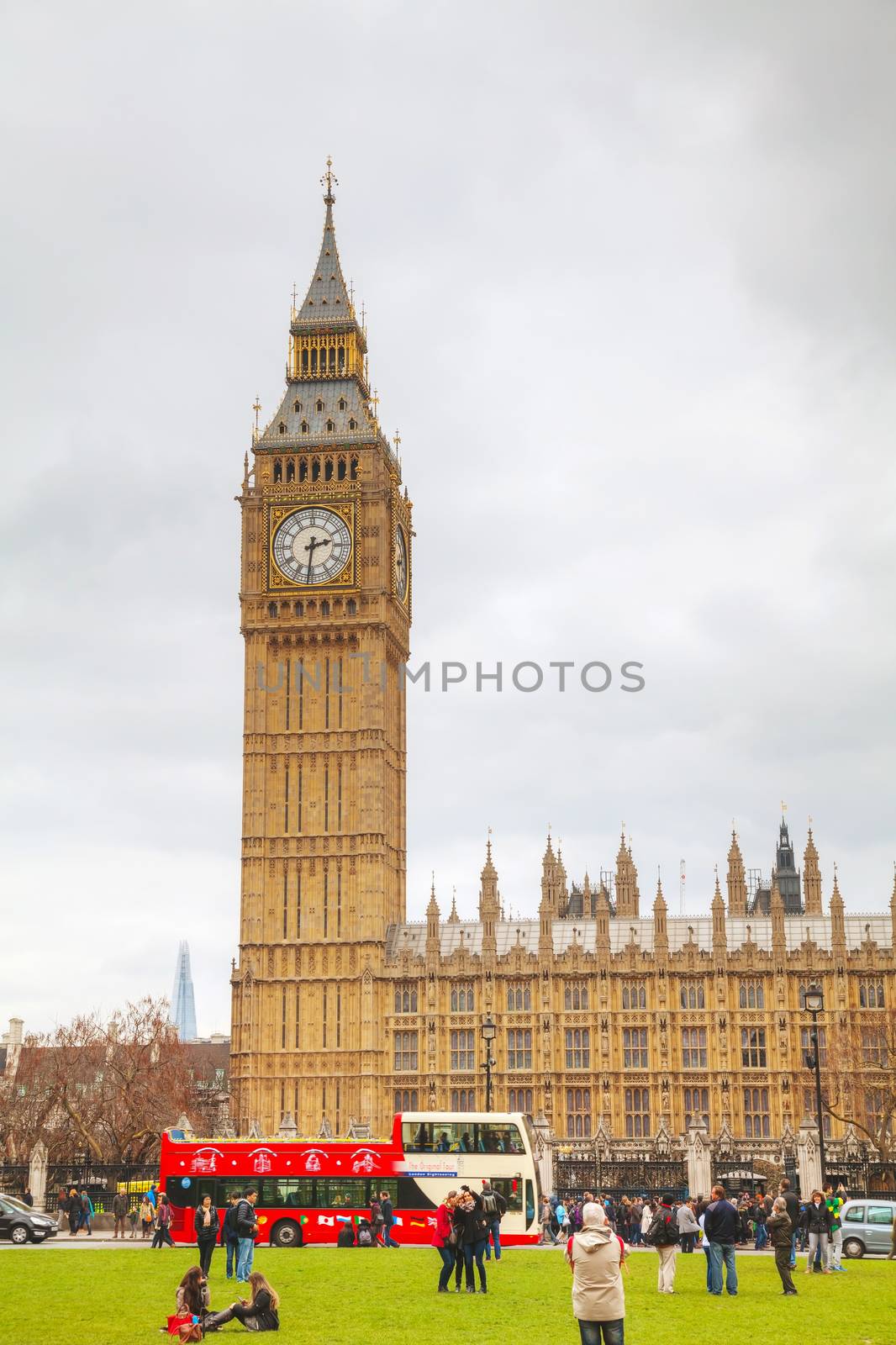 LONDON - APRIL 4: Parliament square with people in city of Westminster on April 4, 2015 in London, UK. It's a square at the northwest end of the Palace of Westminster in London.