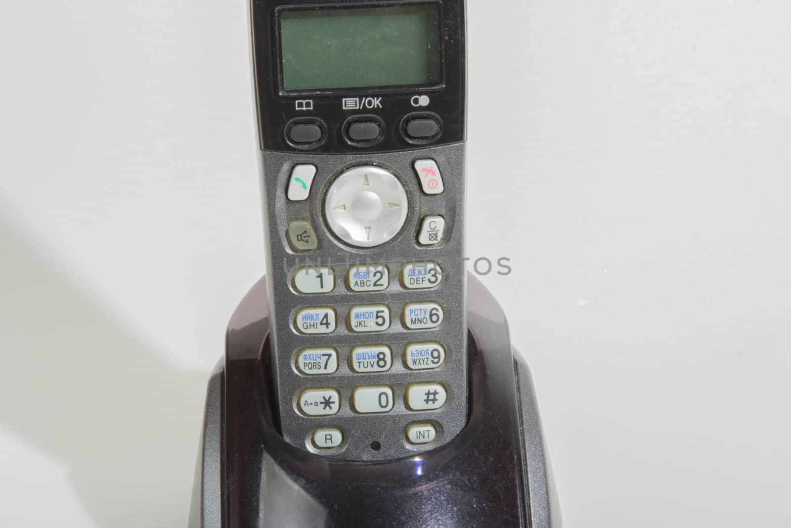 Black cordless phone on a white background