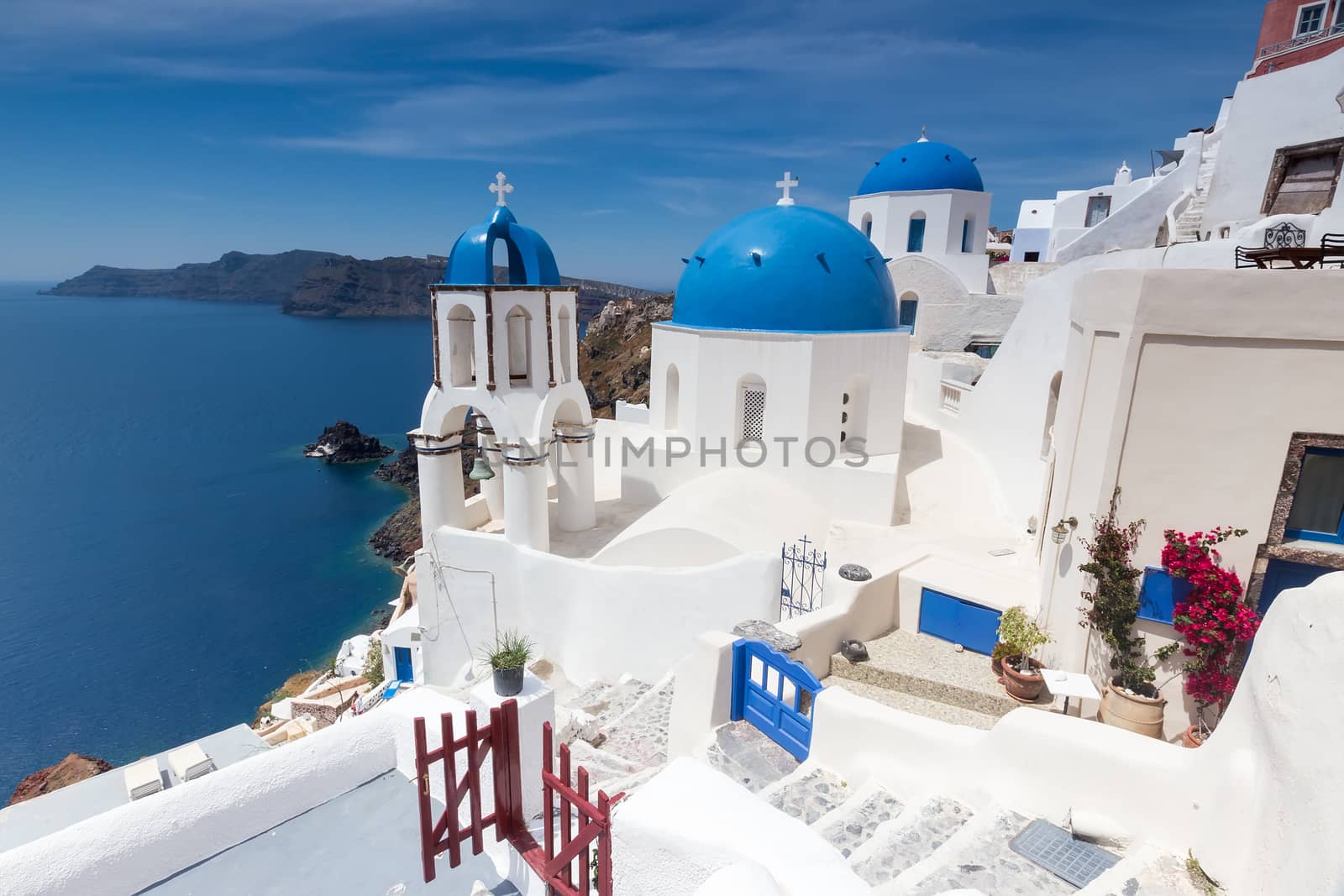 Blue and white church of Oia village on Santorini island. Greece