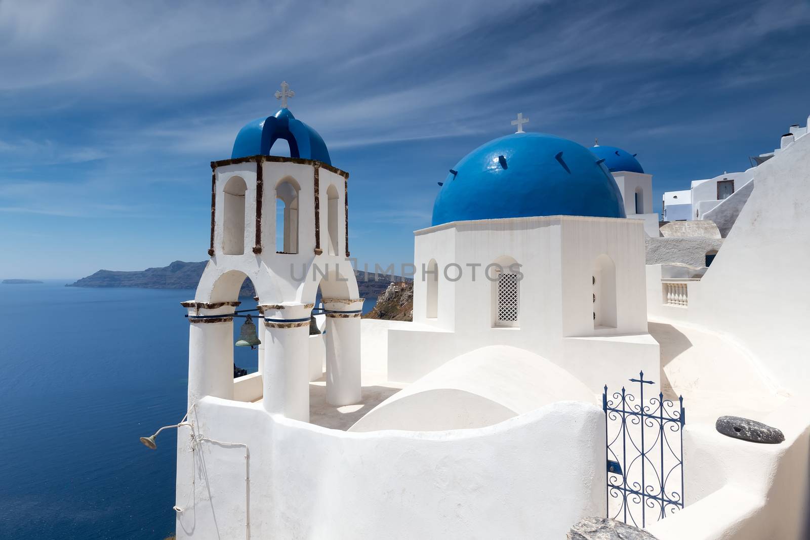 Blue and white church of Oia village on Santorini island. Greece by ververidis