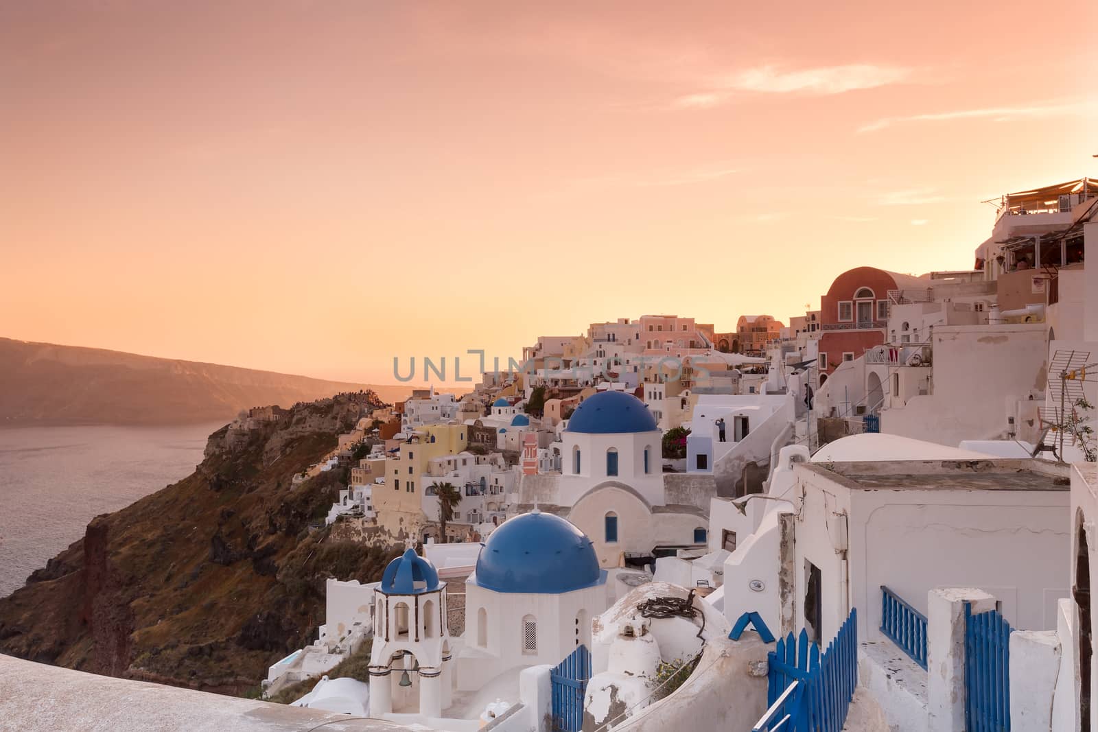 The sunset at Oia village in Santorini island in Greece by ververidis