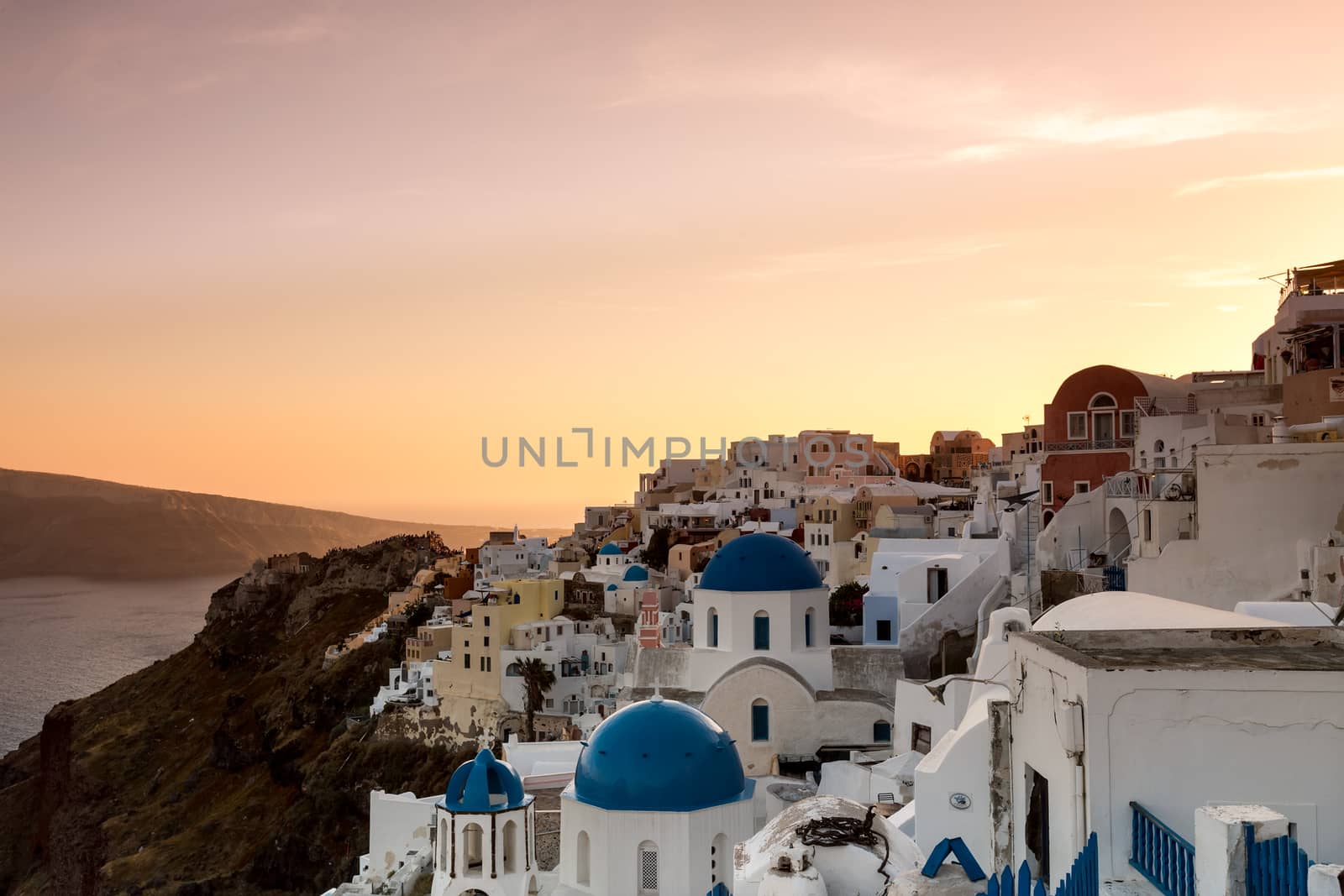 The sunset at Oia village in Santorini island in Greece by ververidis