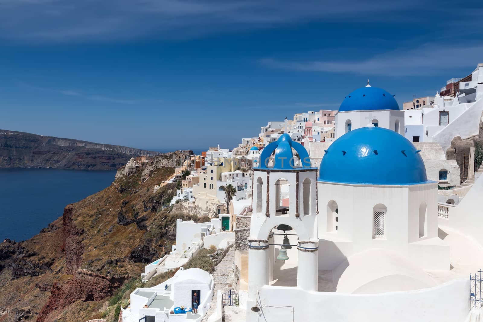 Blue and white church of Oia village on Santorini island. Greece