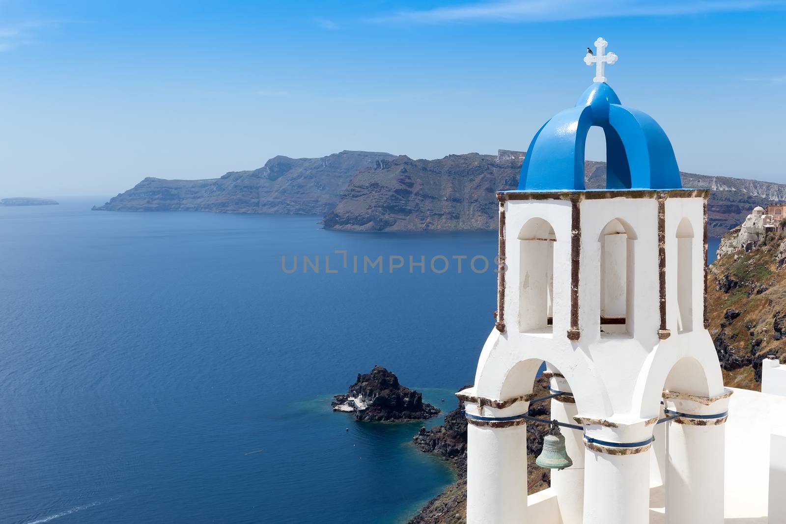 Blue and white church of Oia village on Santorini island. Greece by ververidis