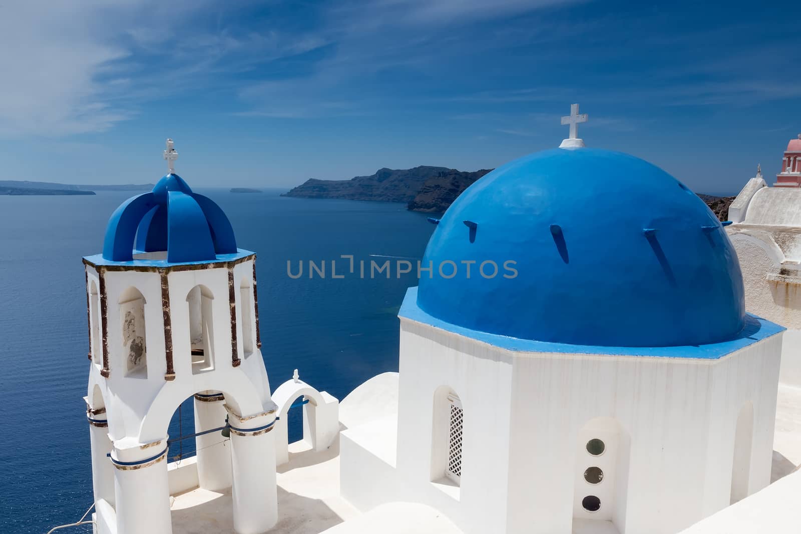 Blue and white church of Oia village on Santorini island. Greece