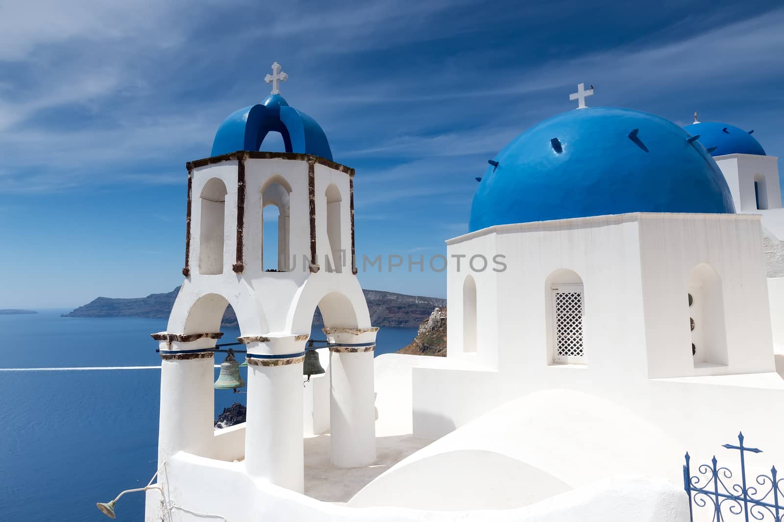 Blue and white church of Oia village on Santorini island. Greece by ververidis