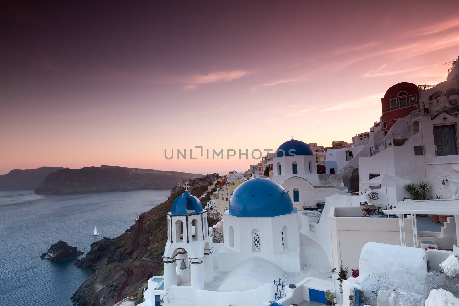 The sunset at Oia village in Santorini island in Greece by ververidis