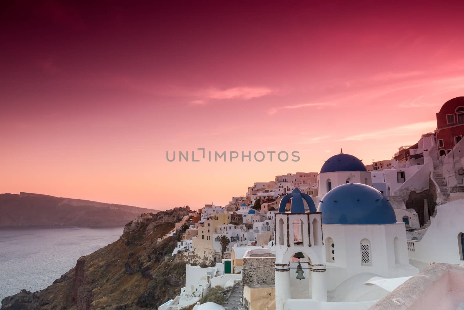 The sunset at Oia village in Santorini island in Greece by ververidis