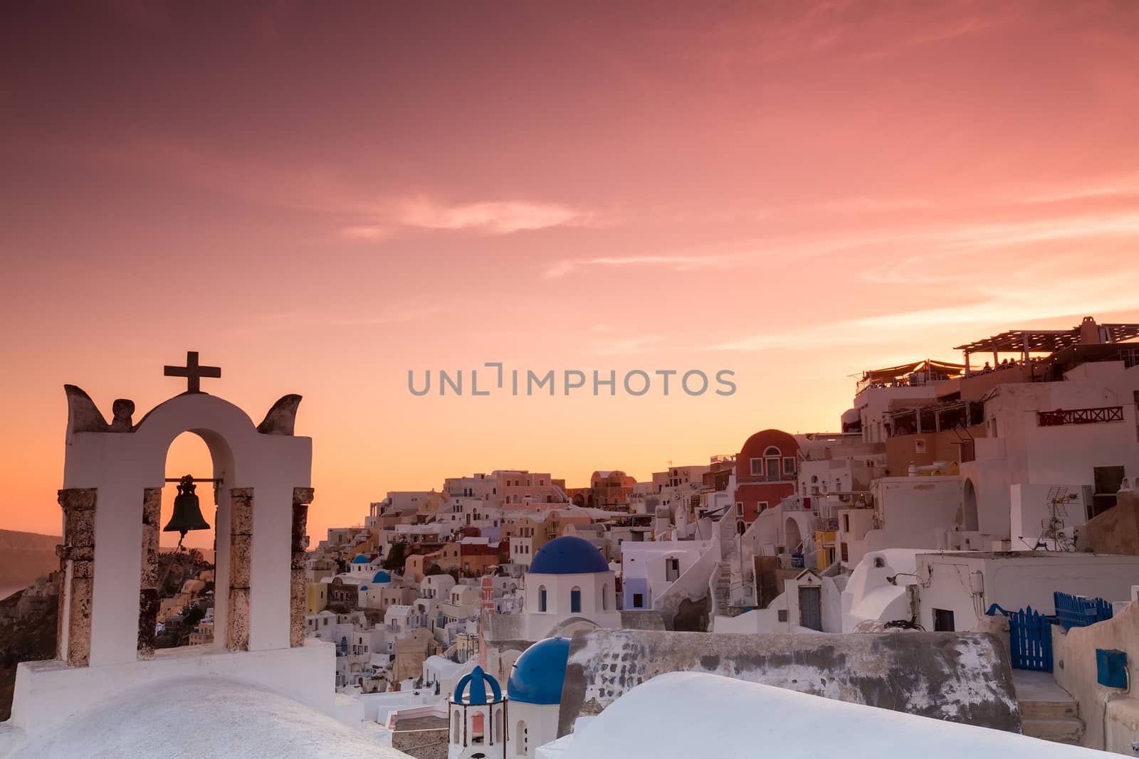 The sunset at Oia village in Santorini island in Greece by ververidis