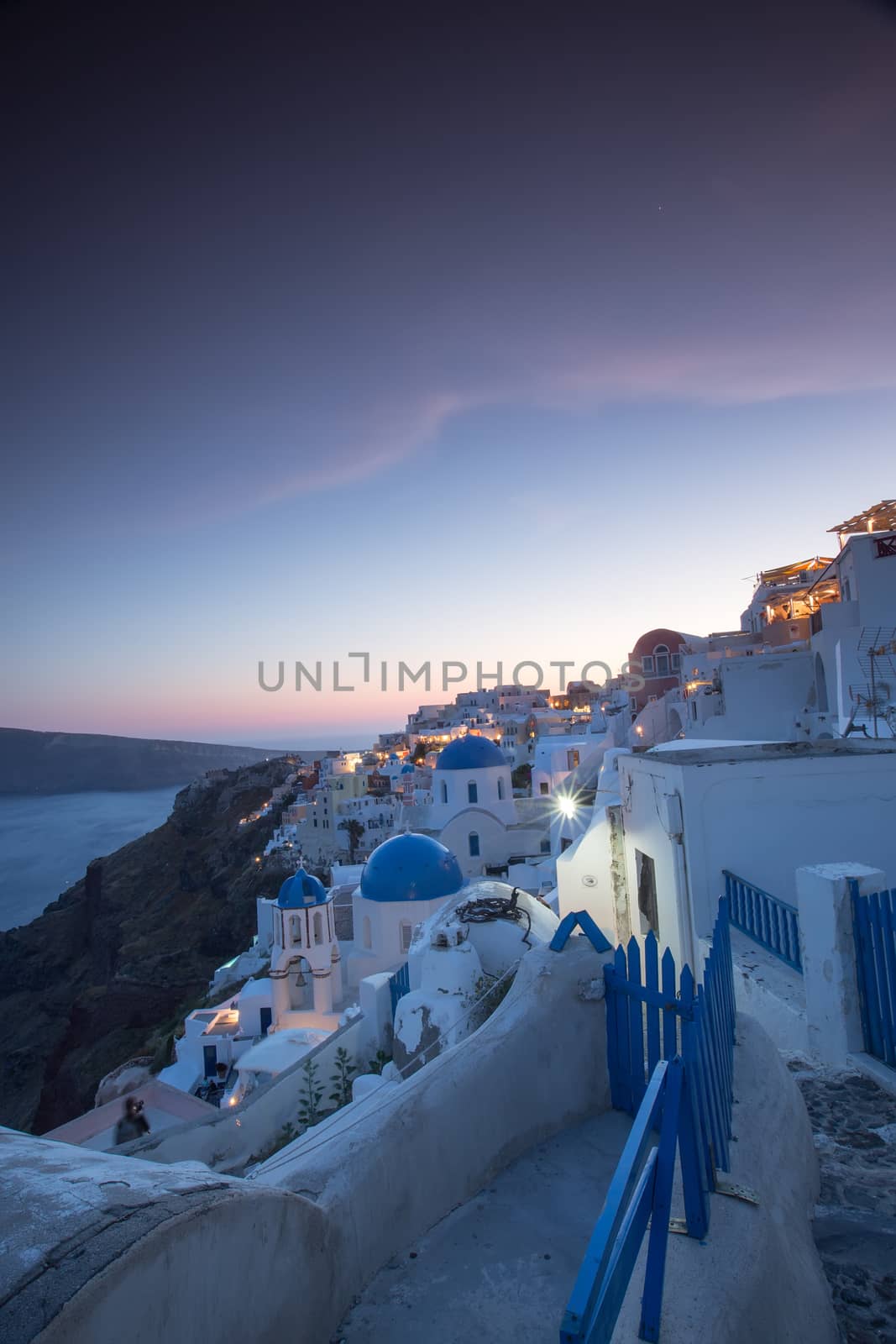 The sunset at Oia village in Santorini island in Greece by ververidis