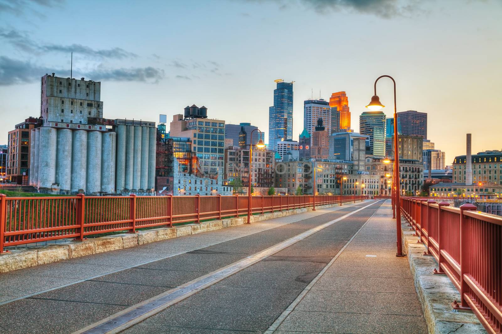 Downtown Minneapolis, Minnesota at night time as seen from the famous stone arch bridge