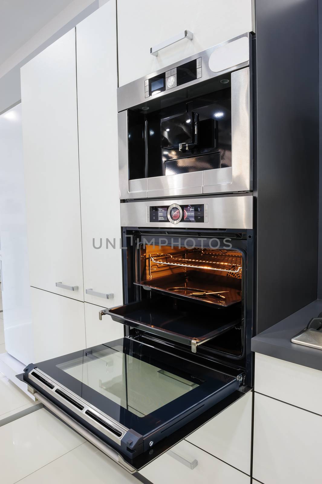 Modern hi-tek kitchen, oven with door open by starush