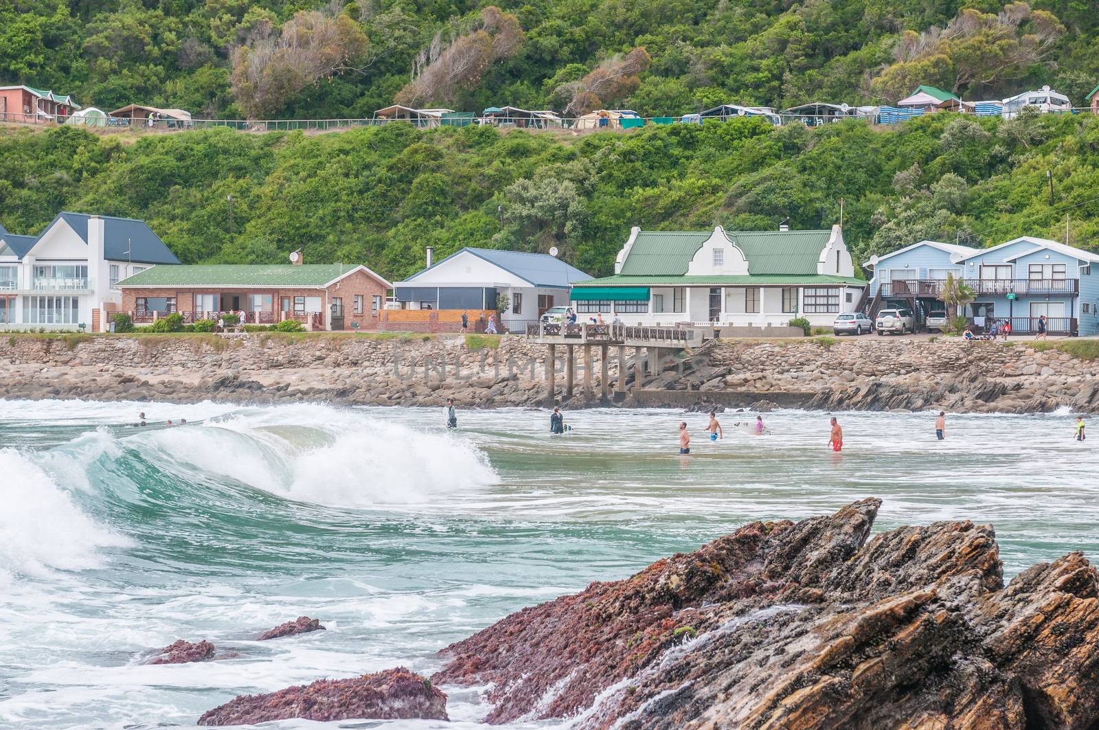 GEORGE, SOUTH AFRICA - JANUARY 4, 2015: Unidentified people, holiday homes and a caravan park at Victoria Bay, South Africa