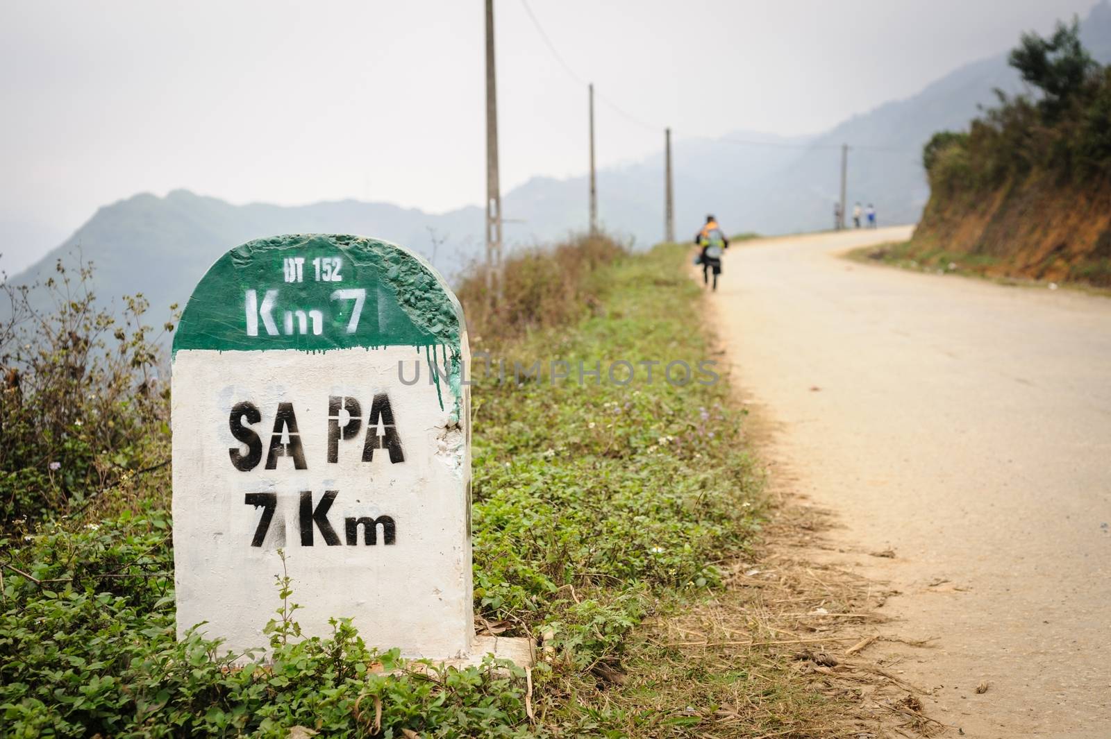 7 kilometer milestone on the highway DT 152 and direction sign to SAPA, north Vietnam.