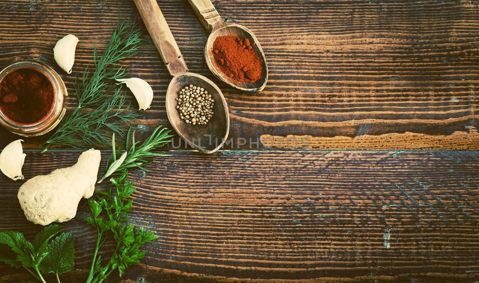 Spices and herbs on wooden table. Top view