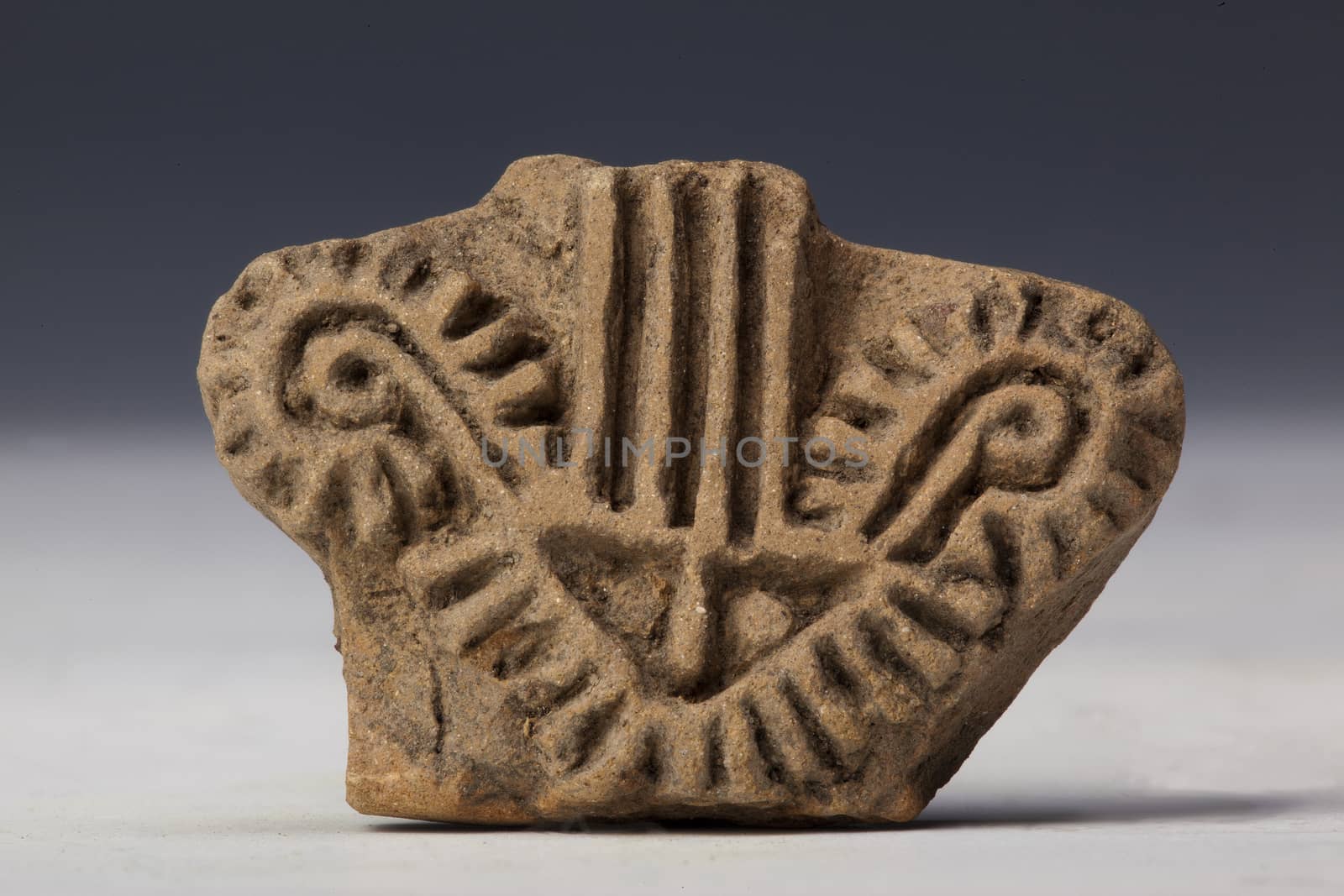 seal, signet with decorum in argil or clay, ancient art of ecuador