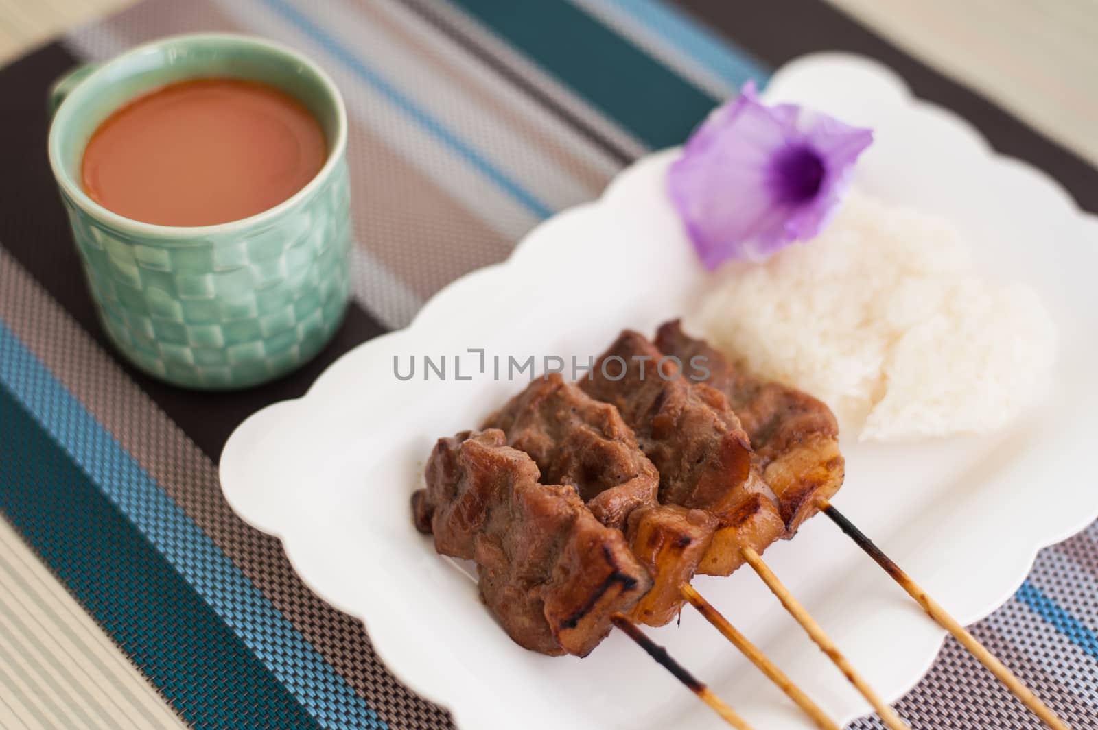Thai-style roasted pork, grilled pork, pork steak, barbecue pork on skewers (Moo Yang, Mu Ping) shoot soft focus 