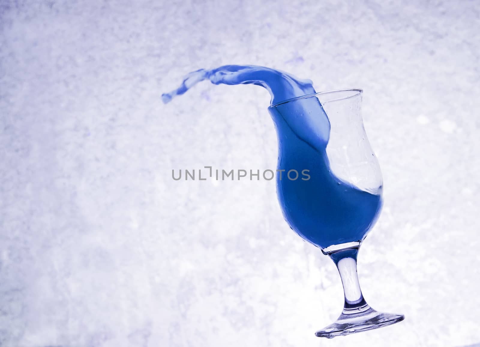 Water Splashing From Glass, Grunge Background by jimbophoto