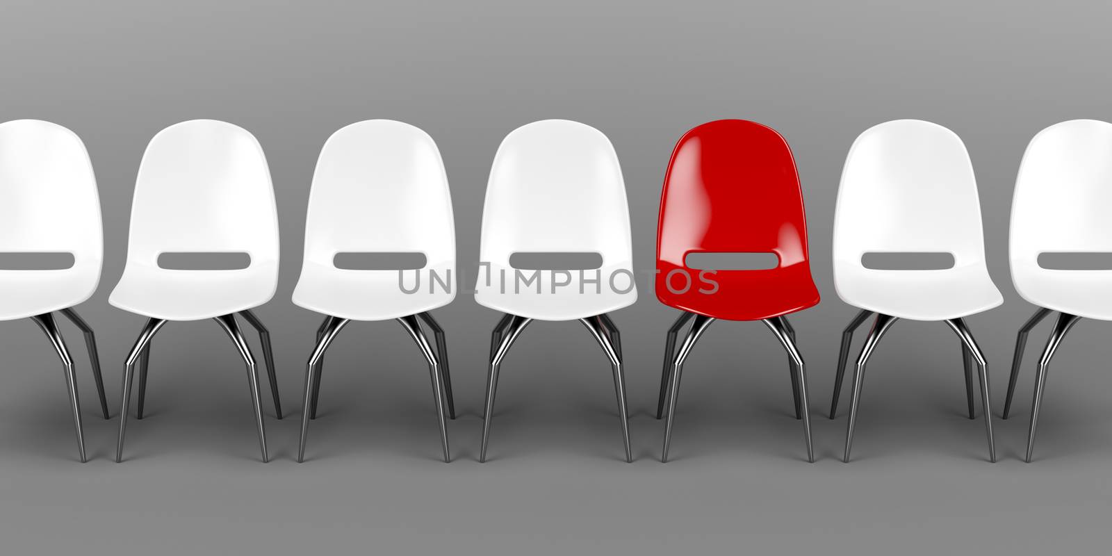 One unique red chair in a row of white chairs