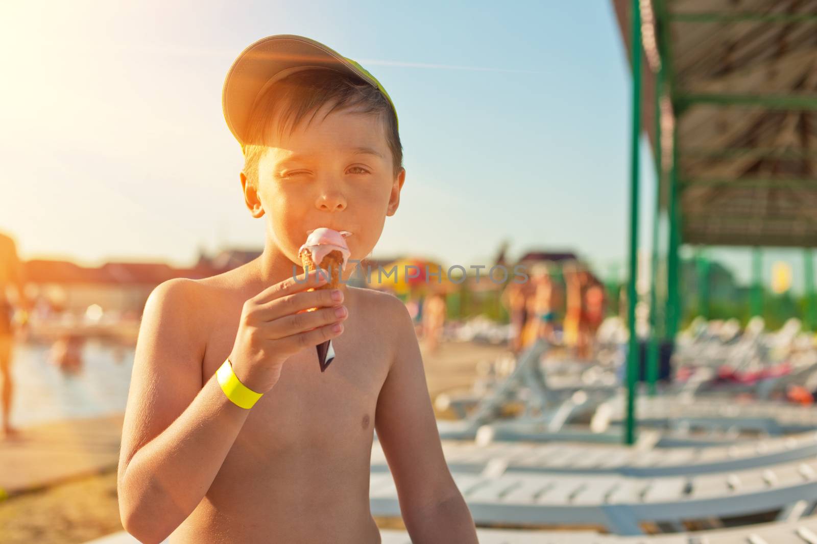Baby boy with ice-cream at the beach