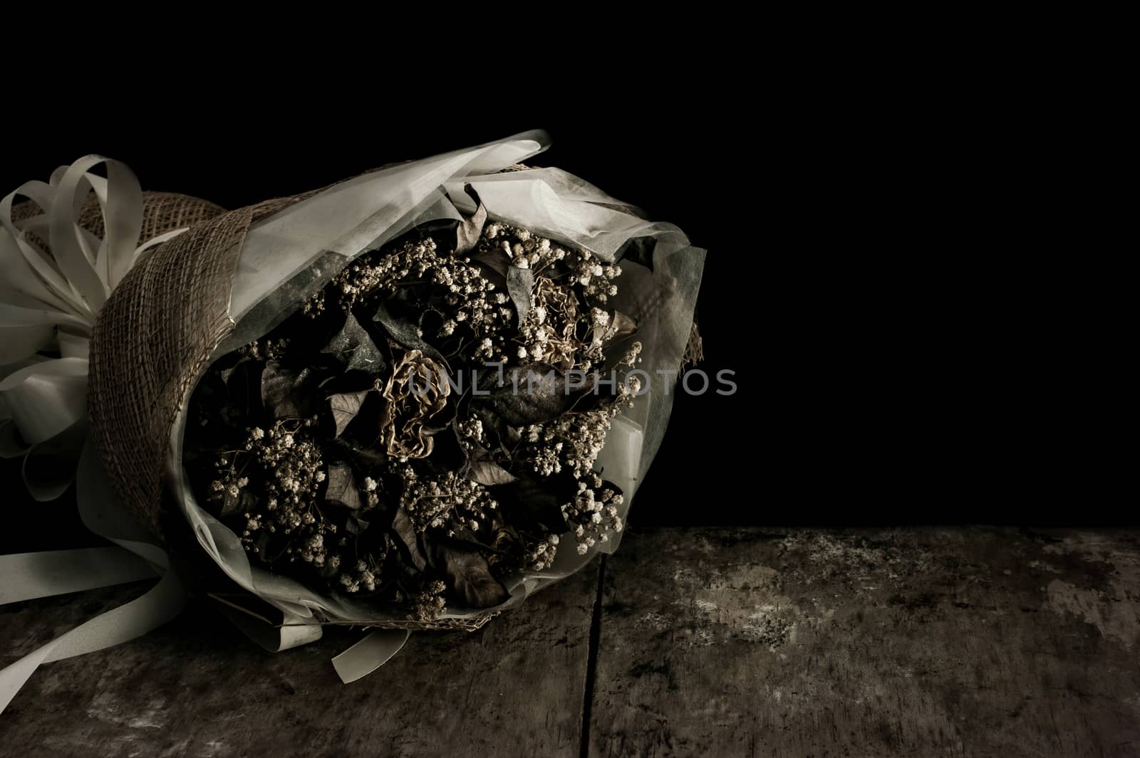 Still life with flower on black background and old wooden table, Dark and shadow