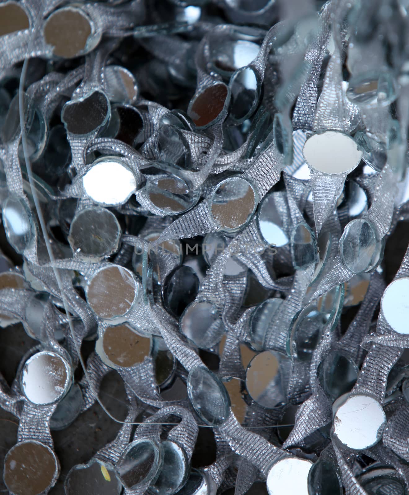 A background of a lace attached with mirrors used for decorations