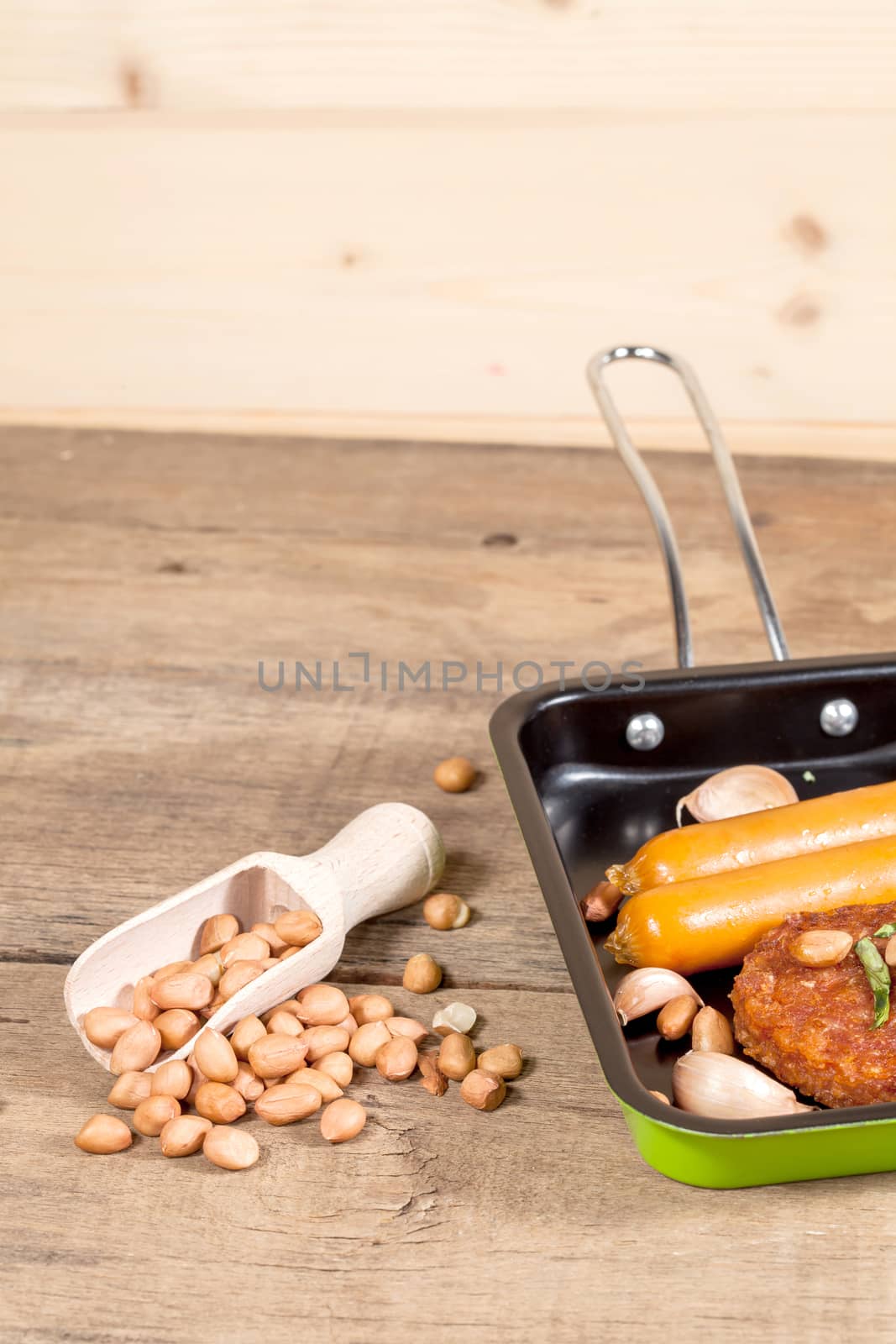 pork fried and  sausages in pan 