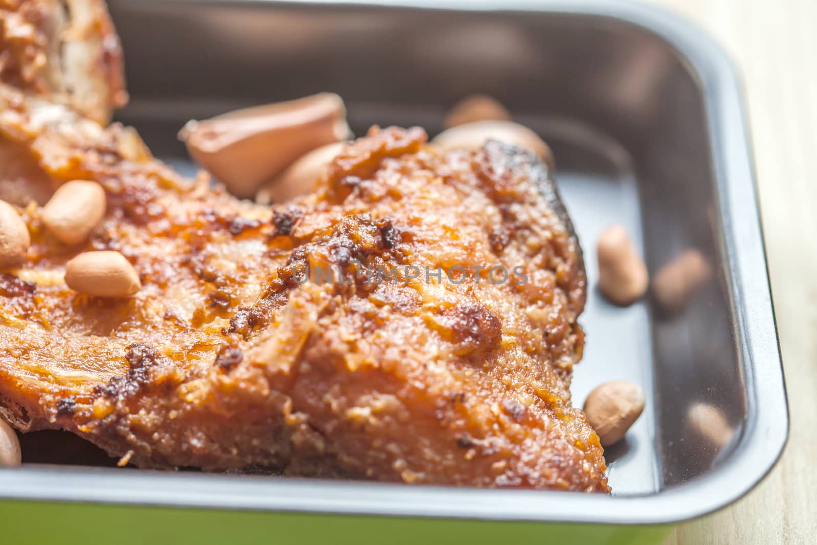 fish fillet fried in the pan on wood