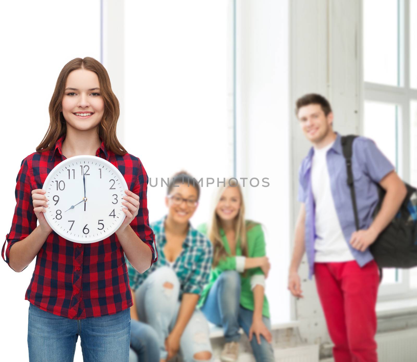 young woman in casual clothes with wall clock by dolgachov