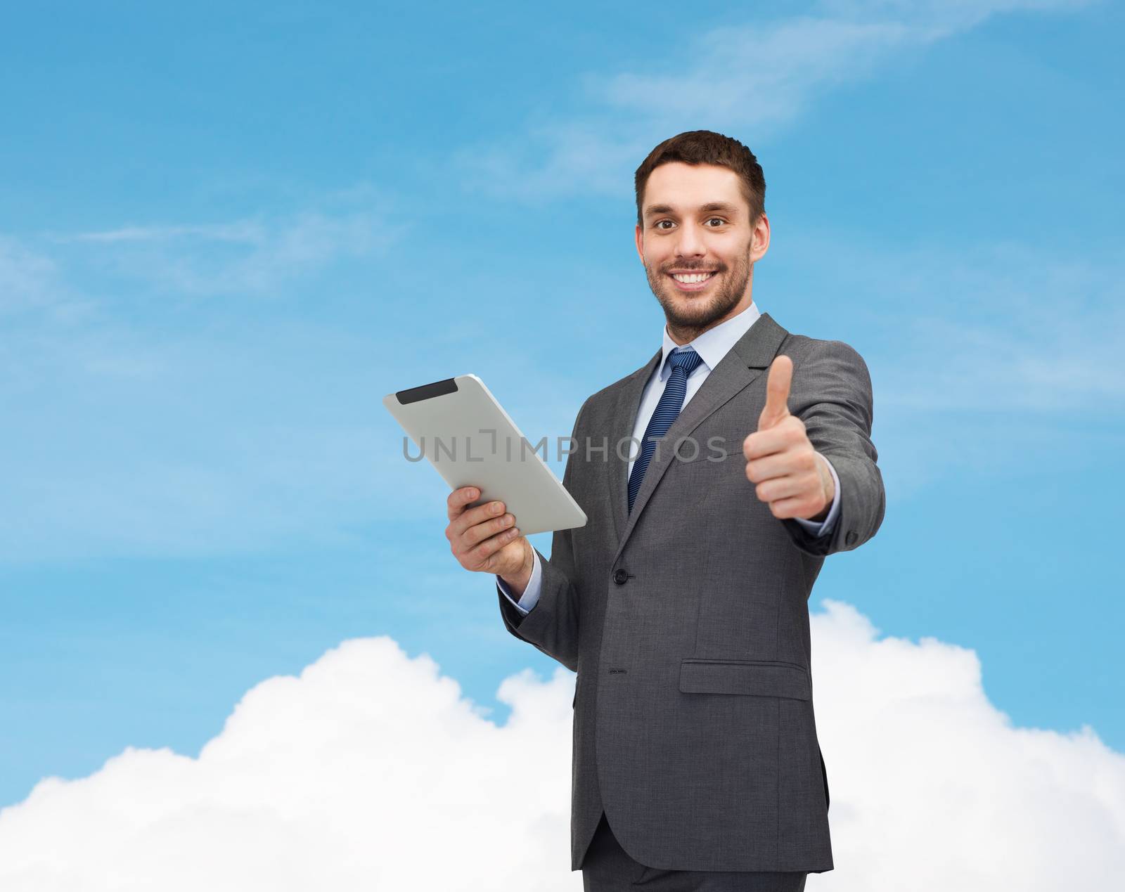 business and technology concept - smiling businessman with tablet pc computer