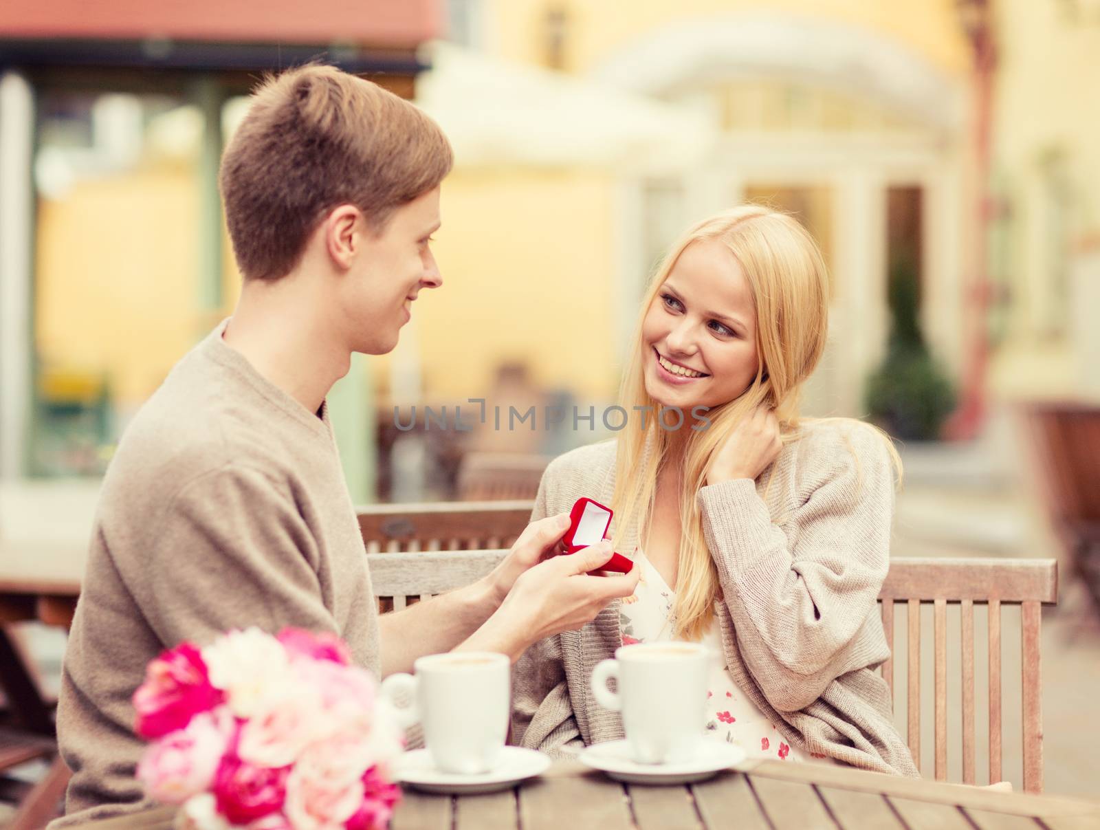 summer holidays, love, travel, tourism, relationship and dating concept - romantic man proposing to beautiful woman