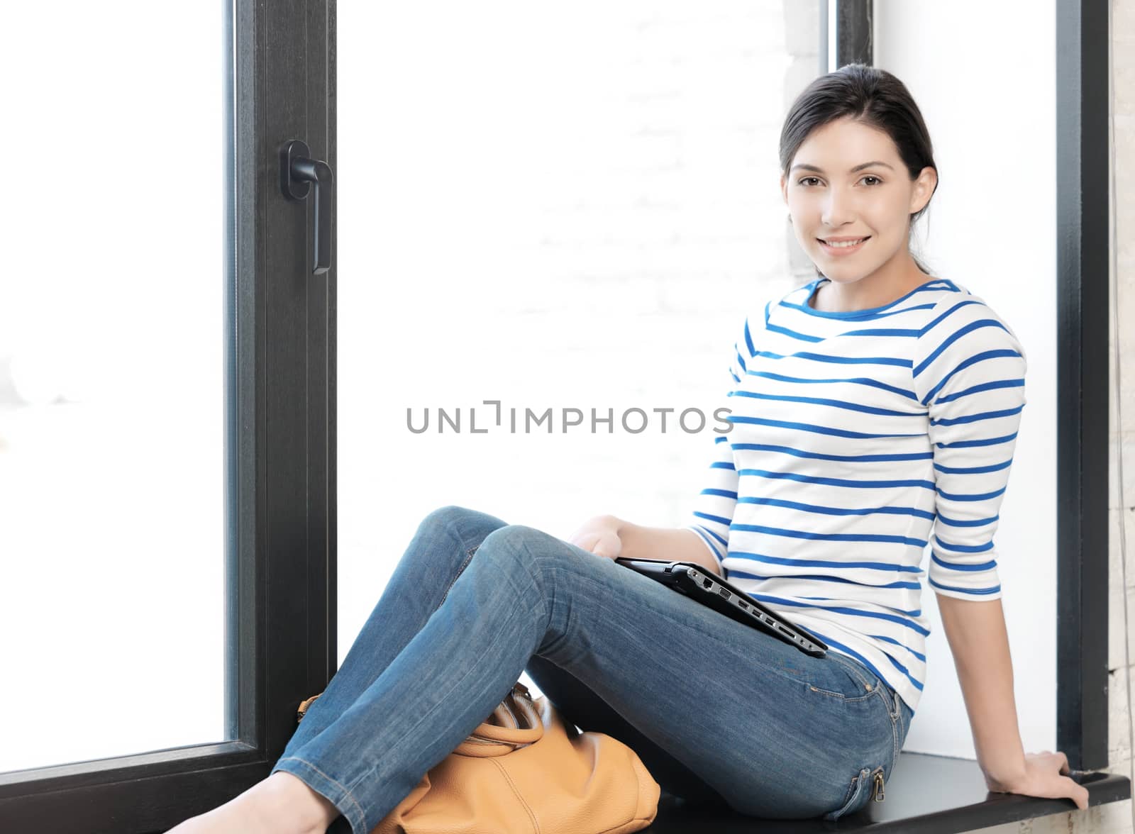 education and technology concept - happy and smiling teenage girl with laptop