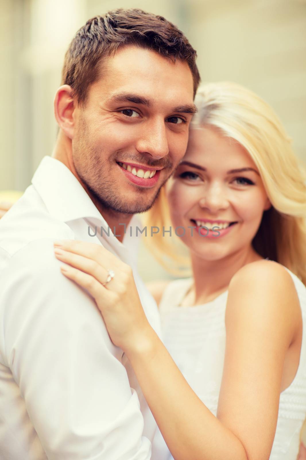 summer holidays, celebration and wedding concept - young engaged couple in the city