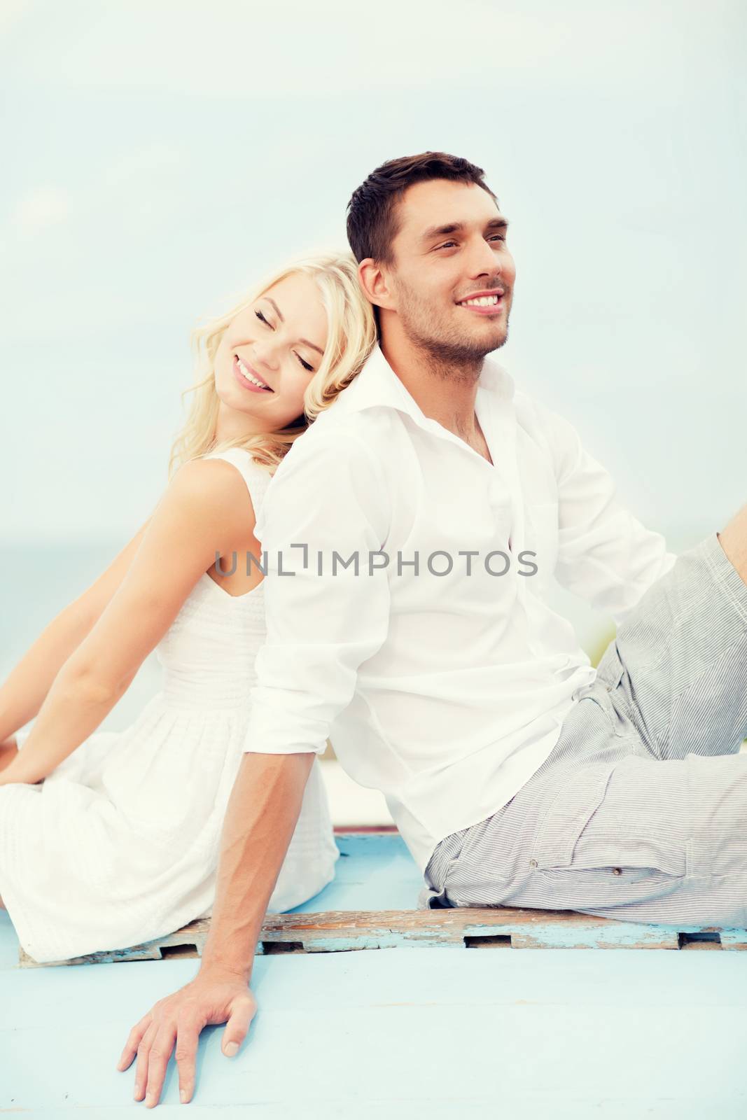 couple in shades at sea side by dolgachov