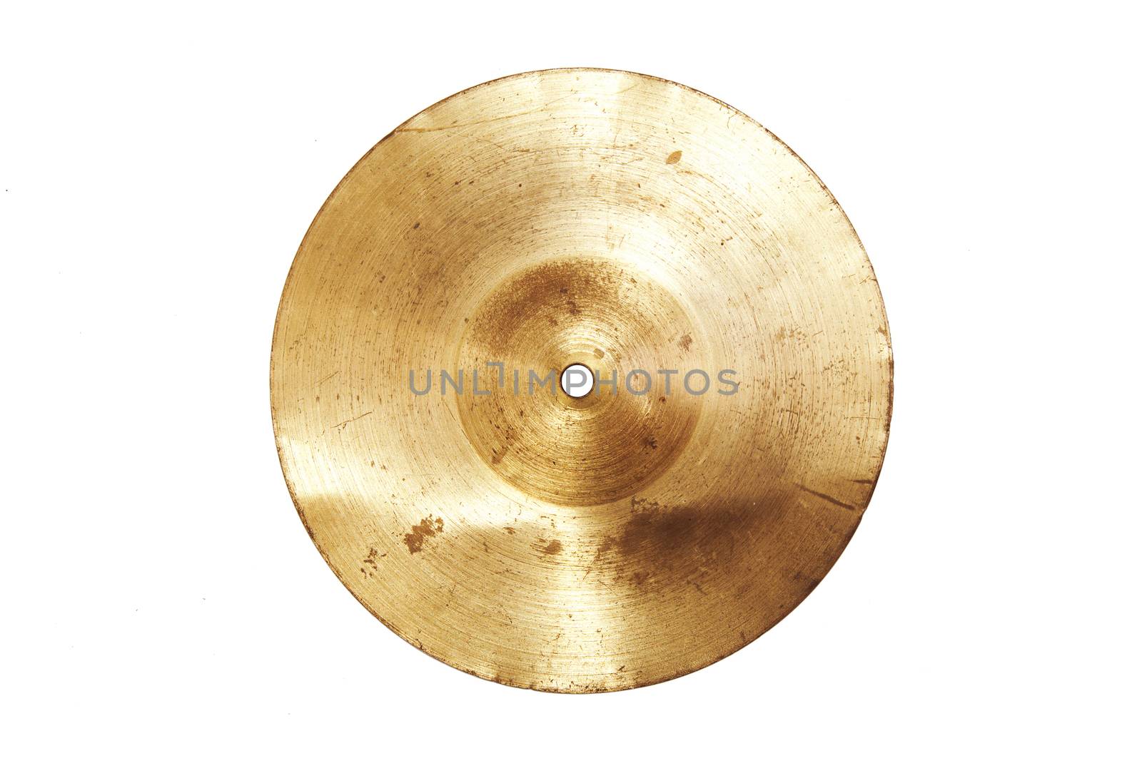 Music conceptual image. Close up of an old cymbal on isolated background.