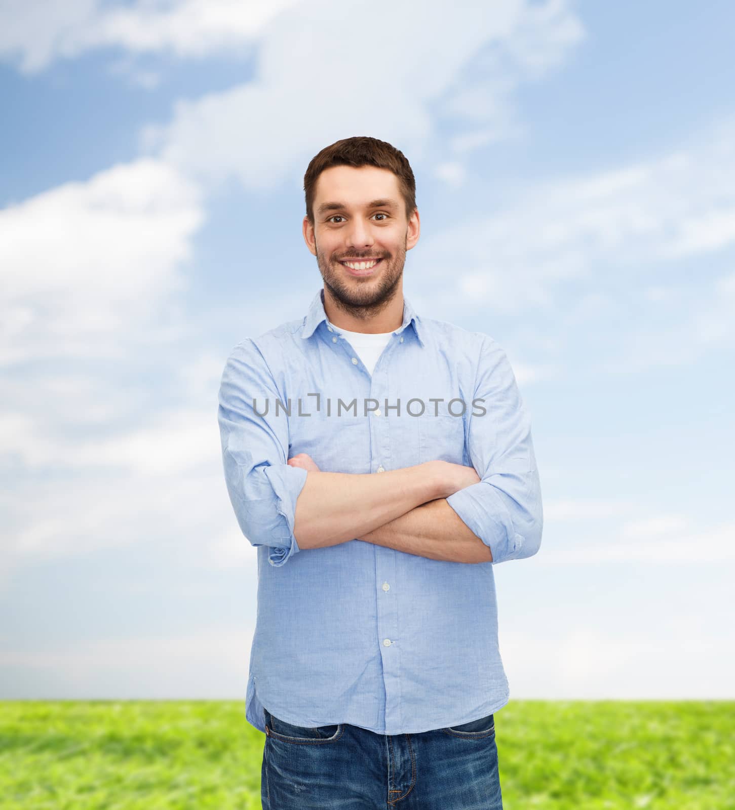 smiling man with crossed arms by dolgachov