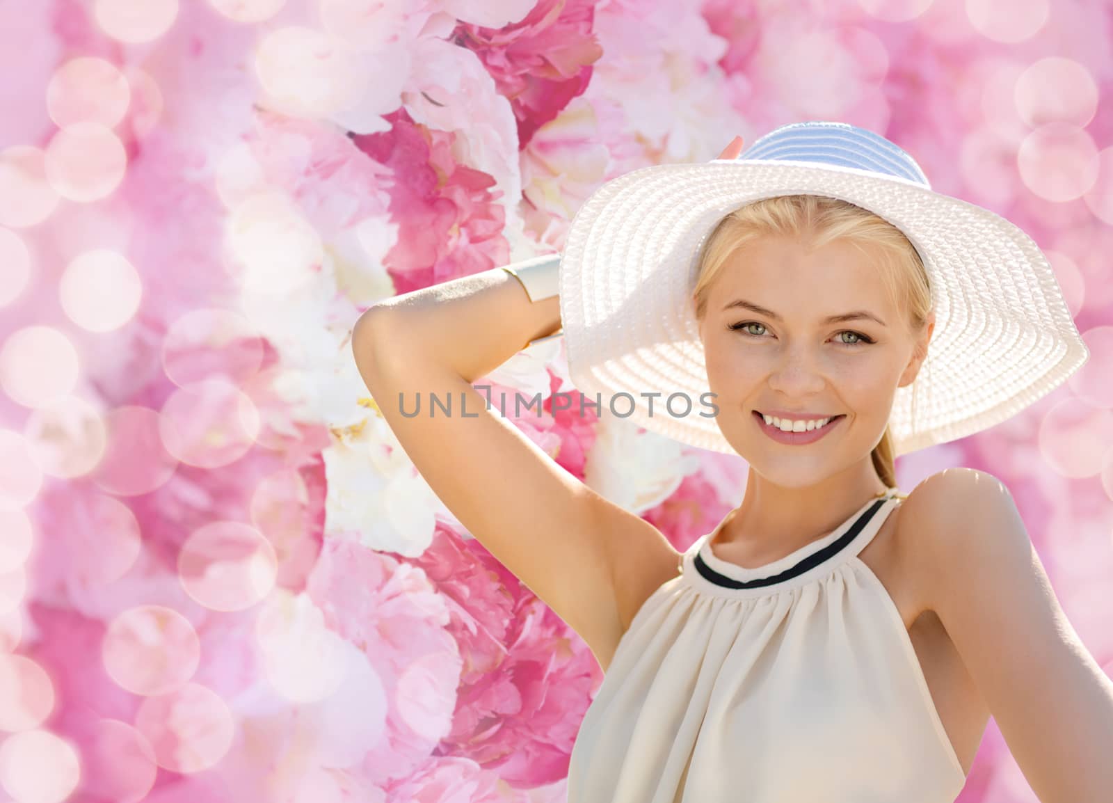 fashion, happiness and lifestyle concept - beautiful woman in hat enjoying summer outdoors