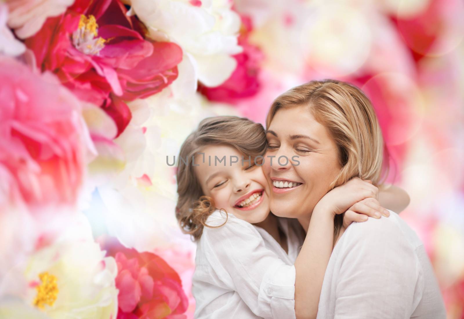 happy mother and daughter hugging by dolgachov