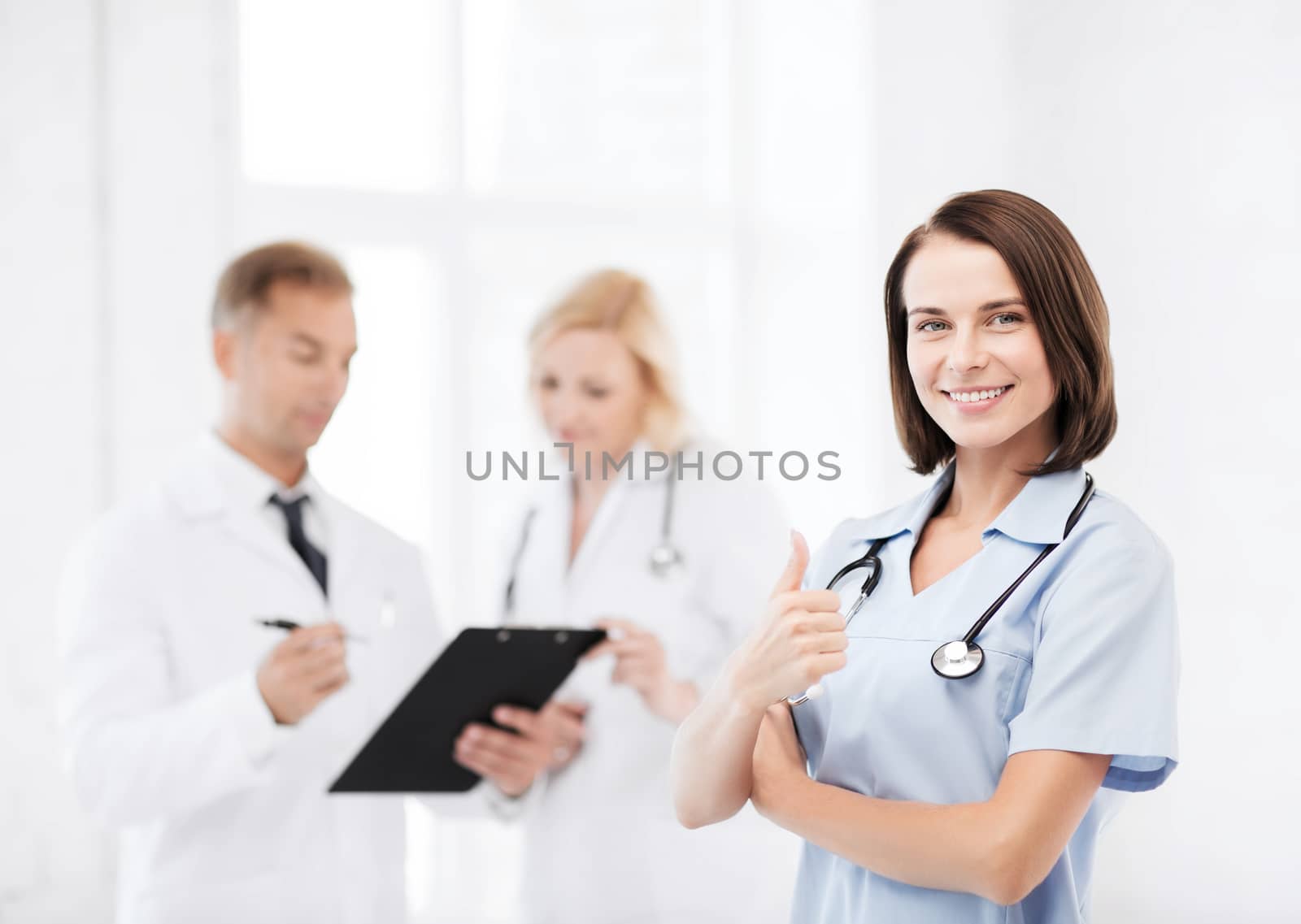 young female doctor with stethoscope by dolgachov