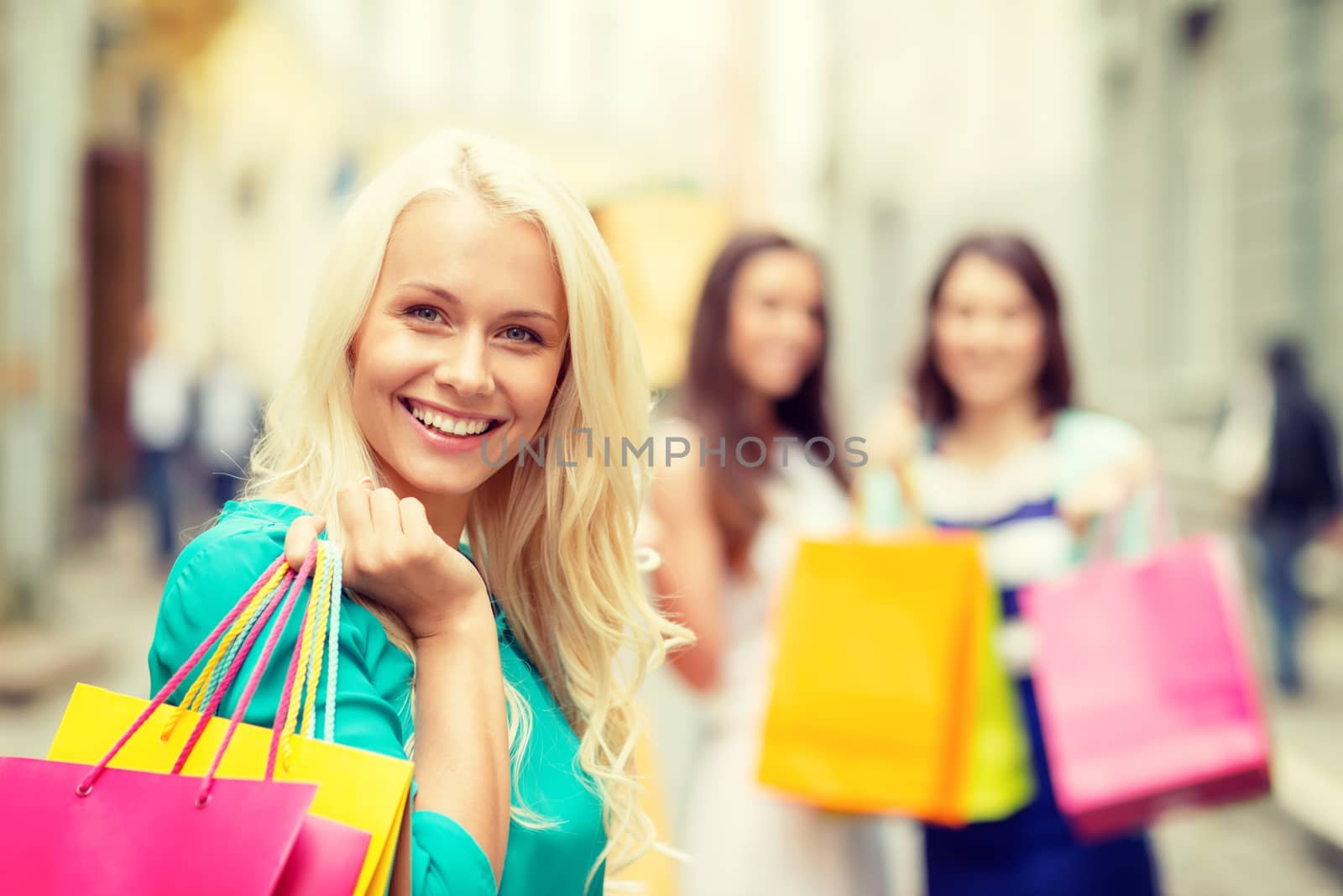 beautiful woman with shopping bags in the ctiy by dolgachov