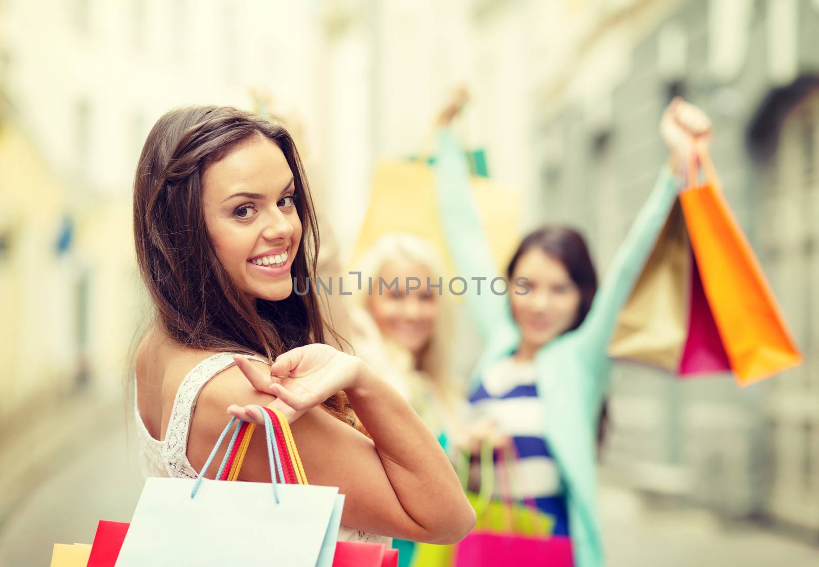 beautiful woman with shopping bags in the ctiy by dolgachov
