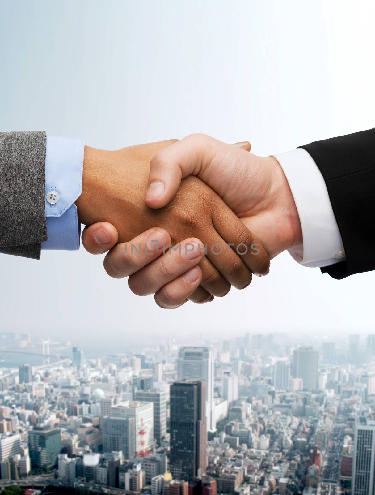 business and office concept - businessman and businesswoman shaking hands